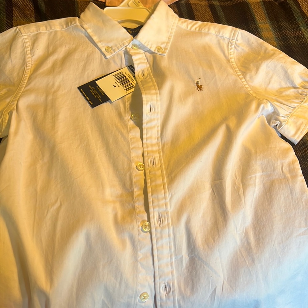 A brand new never worn white girls polo